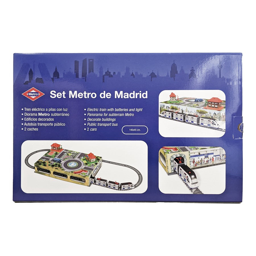 Caja de set de tren eléctrico Metro de Madrid con diorama, edificios y autobús decorativo.