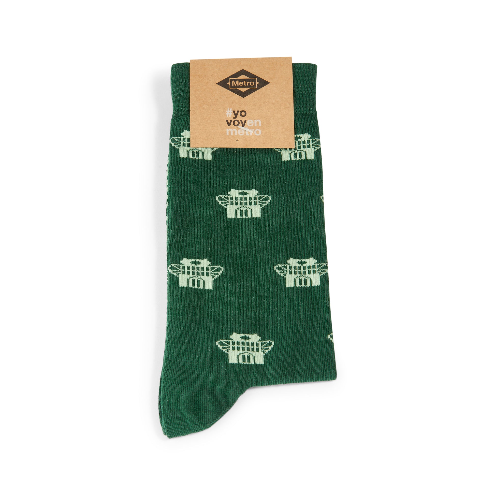 Calcetín verde con patrón blanco de Metro y etiqueta "#yo voven metro"