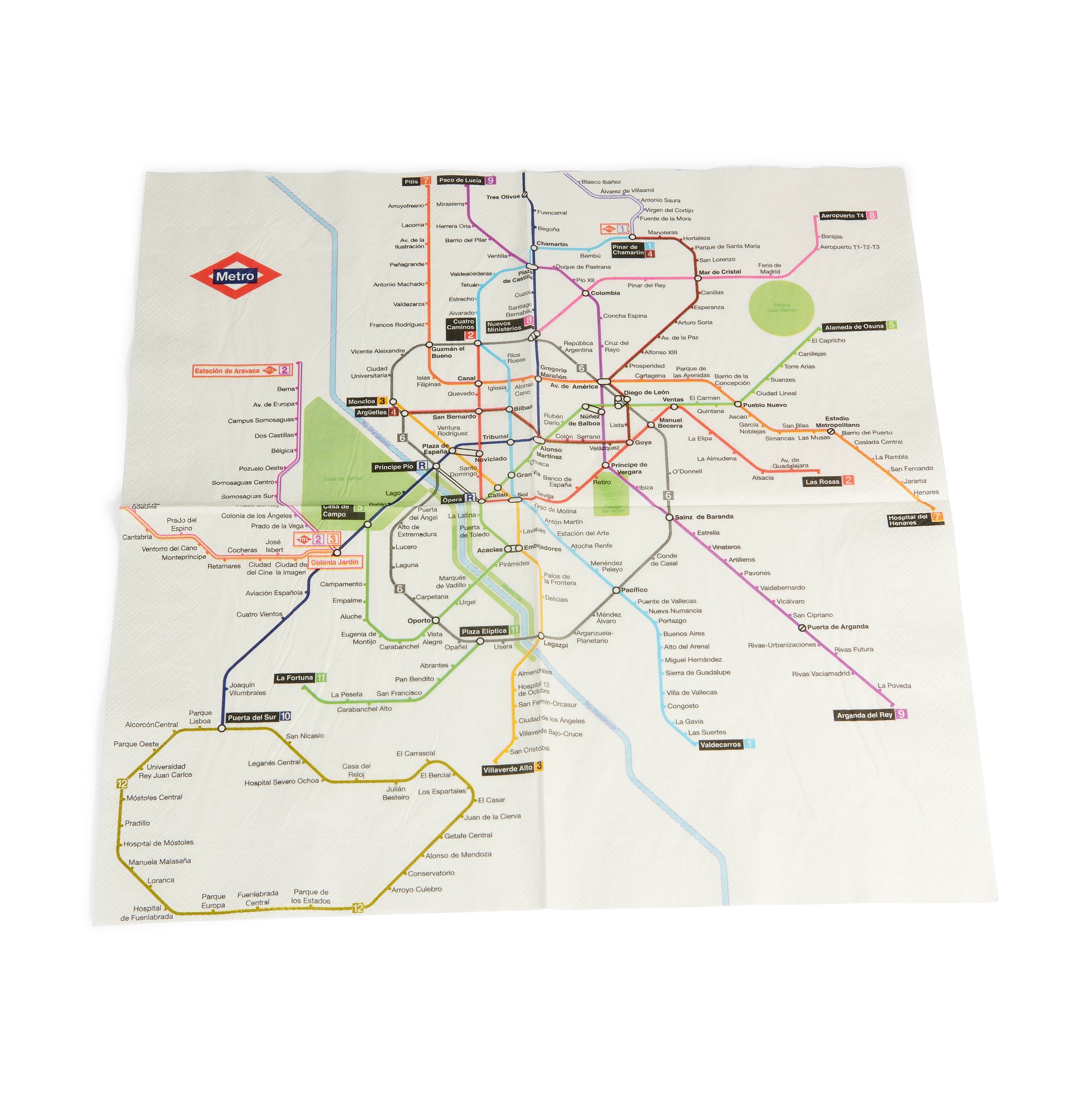 Mapa del metro de Madrid en servilleta, líneas y estaciones de metro coloreadas.