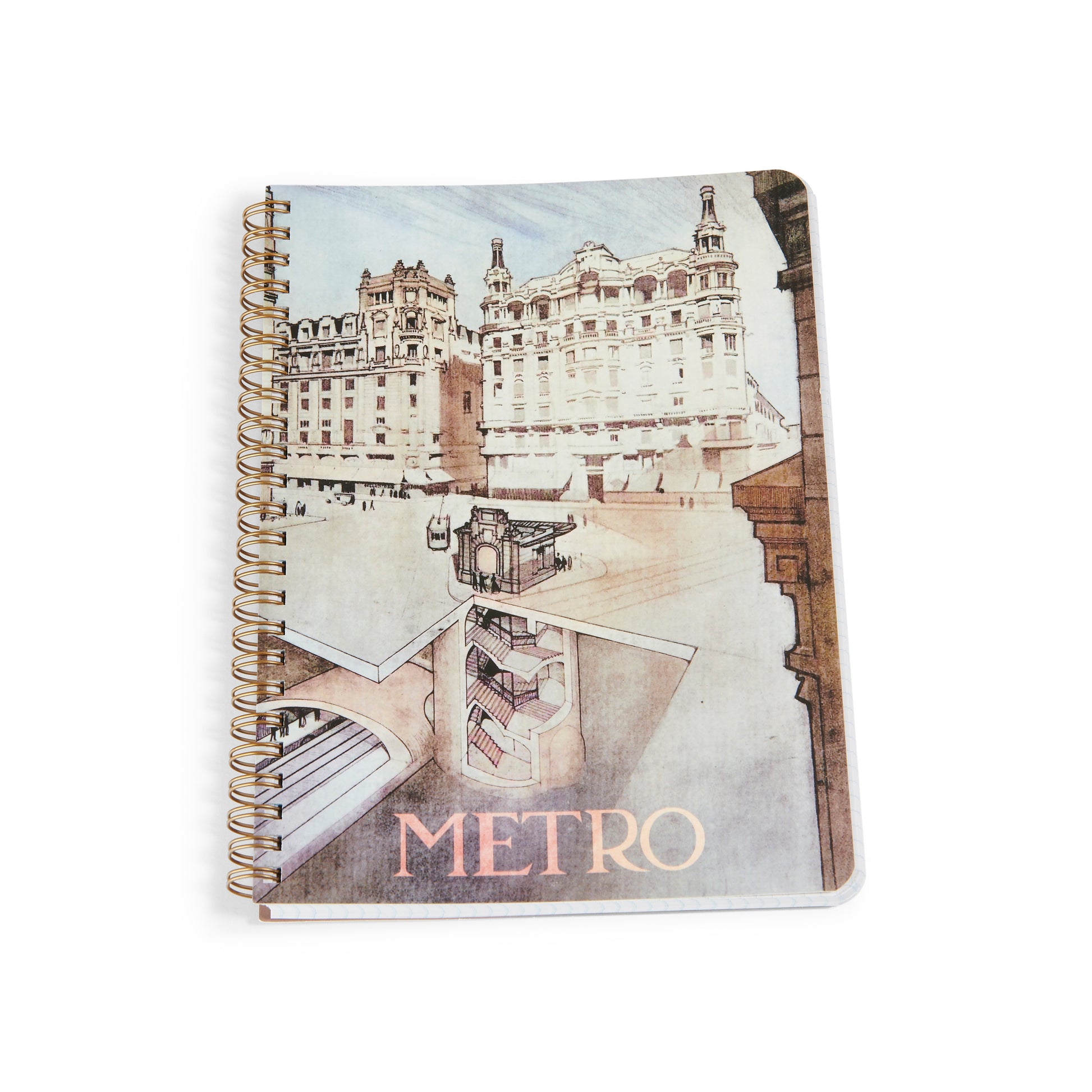 Cuaderno espiral con ilustración arquitectónica de edificio clásico y metro, portada 'METRO'.