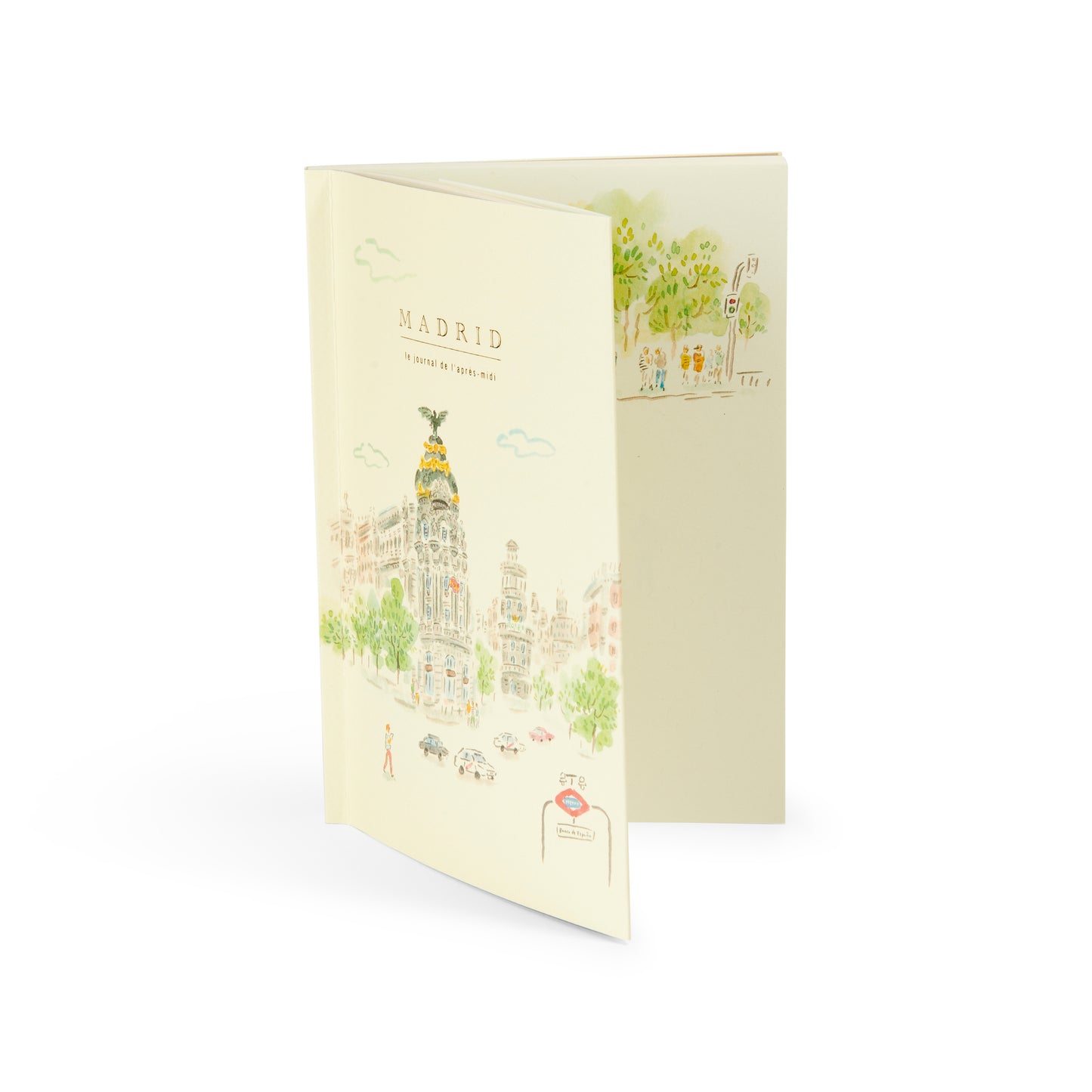 Cuaderno ilustrado de Madrid con dibujo del edificio Metrópolis y estación de metro