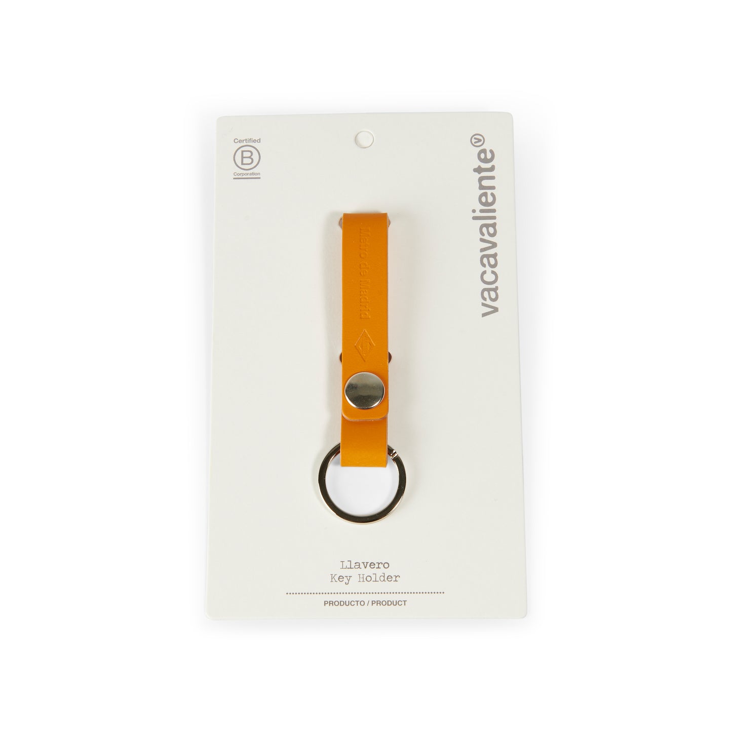 Llavero de cuero naranja Vacavaliente con anilla metálica, empaquetado en tarjeta blanca.